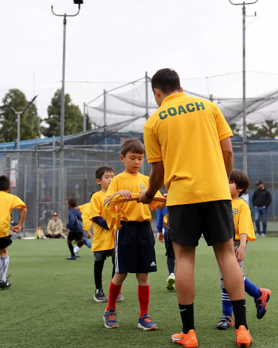 Coaches providing guidance during a scrimmage
